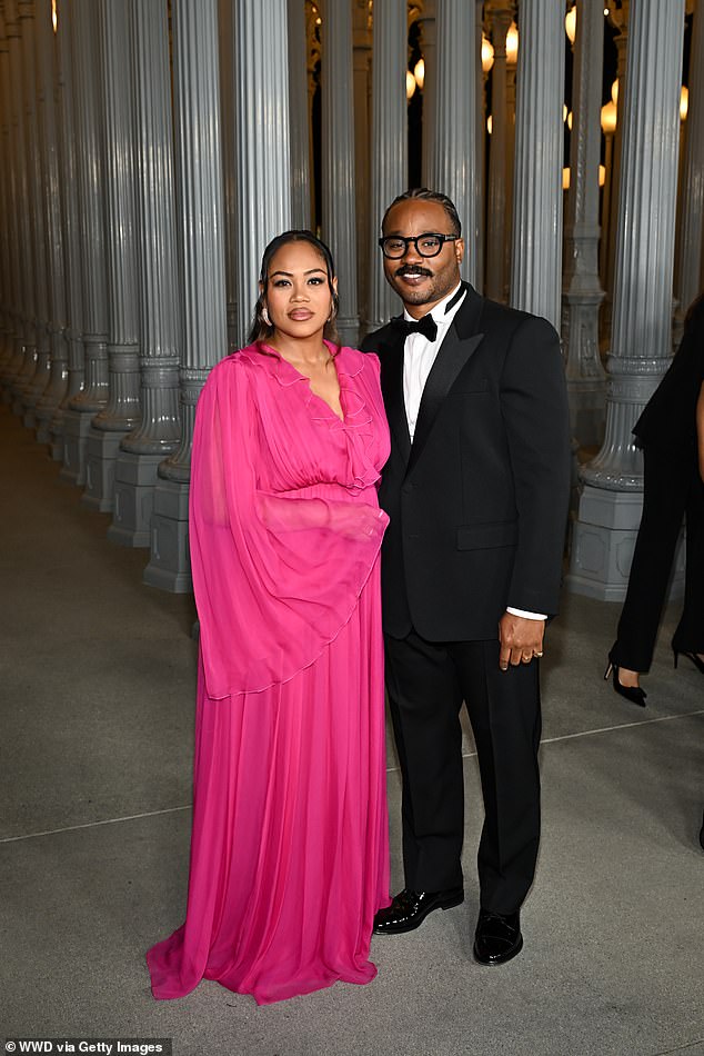 The evening's honoree, Ryan Coogler, wore a classic black tuxedo with peaked lapels and a bow tie. His wife Zinzi added a splash of color in a flowing fuchsia dress