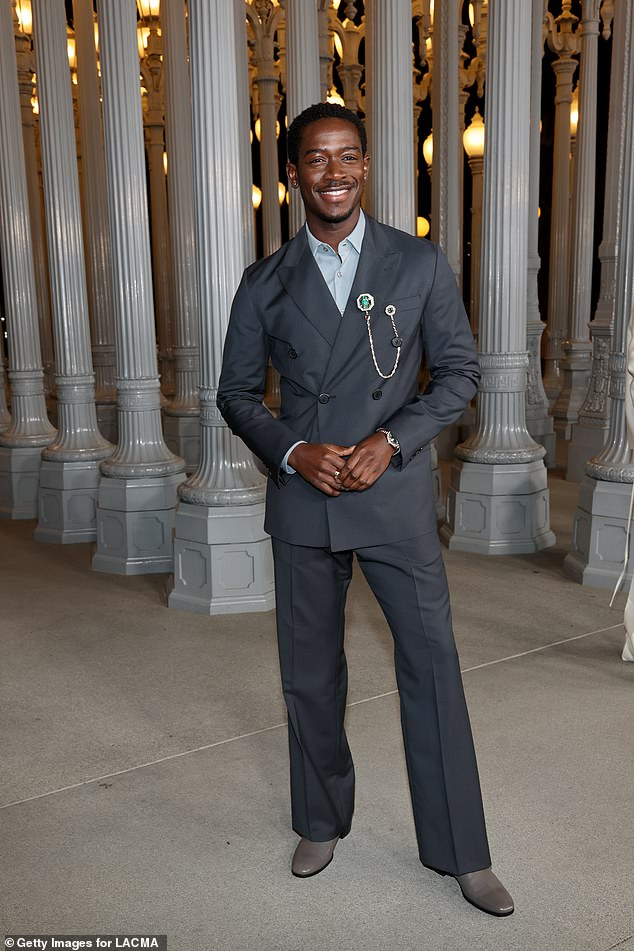 Damson Idris looked stylish in a slate-gray double-breasted suit with lighter-gray boots