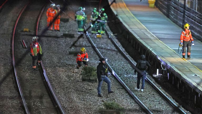 Emergency crews spilled out onto the tracks. Pic: PA