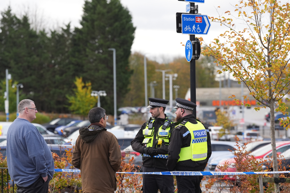 Police outside Huntingdon station after knife attack