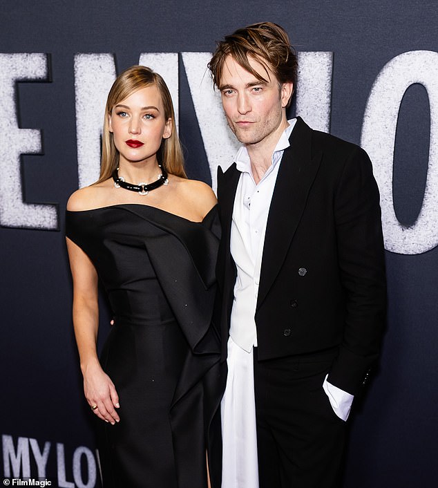 Lawrence ¿ who recently admitted she's planning on a boob job ¿ opted for a bold red lip