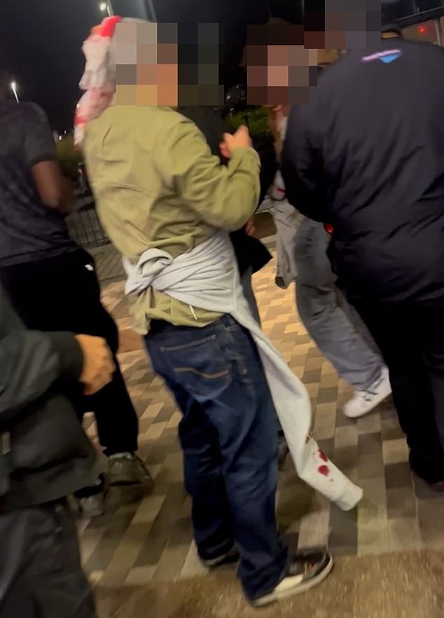 In a video, one hero held a rag to his head as crimson-coloured blood seeped through