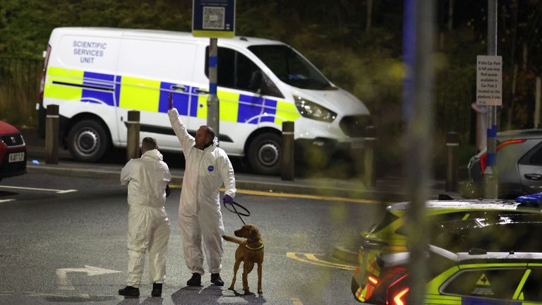 Forensic officers at Huntingdon Station. Pic: PA