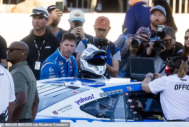 Hamlin reacts after climnbing out of his car following the NASCAR Championship race