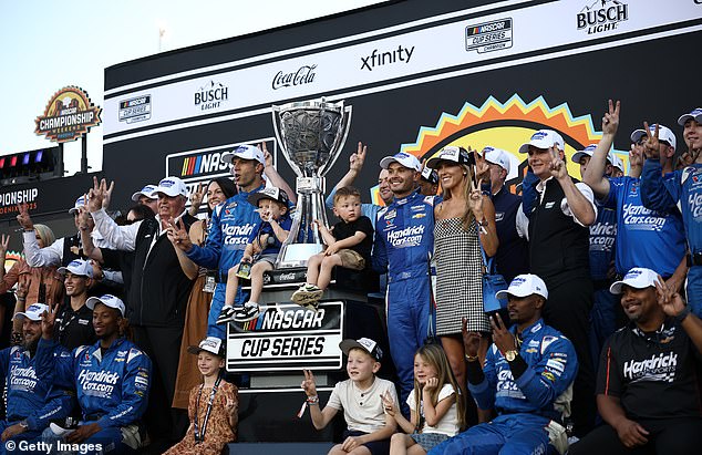 Kyle Larson, driver of the #5 HendrickCars.com Chevrolet, celebrates with his crew and family in victory lane after finish first of the NASCAR Cup Series Championship
