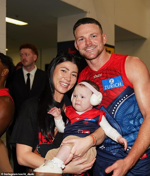 Melbourne Demons star Steven May, pictured with his young family, has also denied any involvement