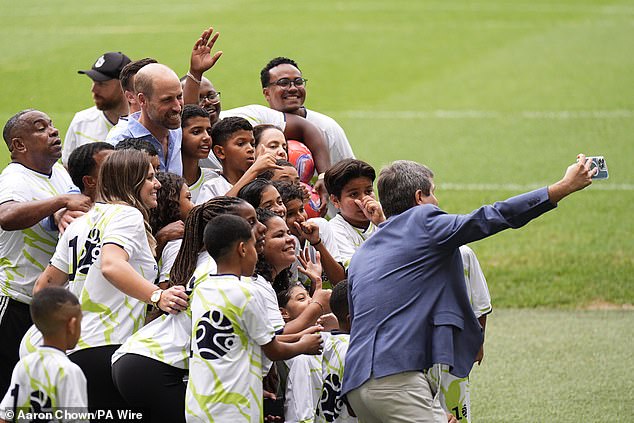 The Prince of Wales takes part in a community football event, with community leaders and local young people who run and participate in football programmes across the city and the state, at Maracana Stadium in Rio de Janeiro