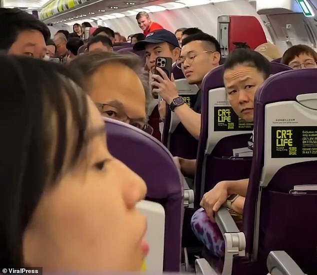 Her fellow passengers looked on in disbelief as her wailing filled the plane's cabin