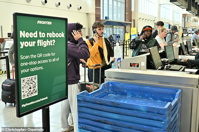 Frontier is one of America's most popular low-cost air carriers where passengers are typically able to secure tickets for below-market average prices, but are charged for every additional benefit of flying. Frontier passengers are seen at the check-in counter in Atlanta on Friday