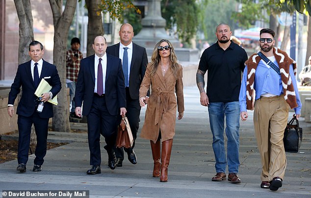 Richards, seen leaving court with her legal team on Friday, has accused her ex of physical abuse and threatening her - which Phypers denies