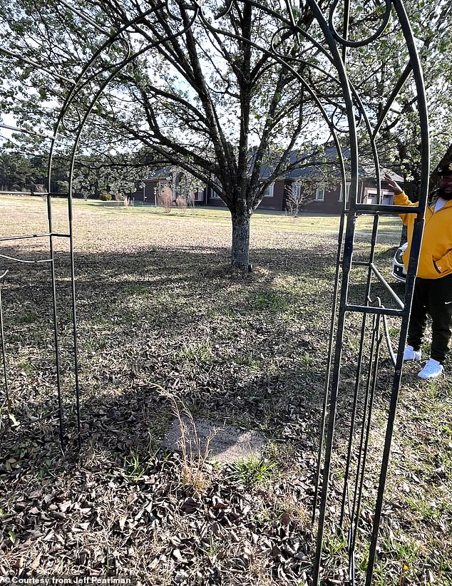 Dante Powers is pictured showing the author the site of Tupac's grave in Lumberton
