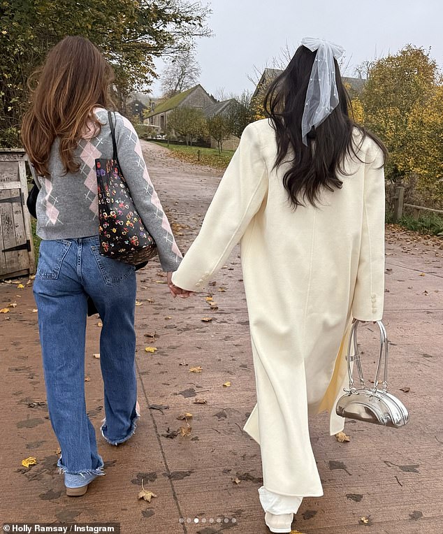 In the photos, Holly looked stunning in all white, wearing a long wool coat layered over a long-sleeved top and wide-leg jeans