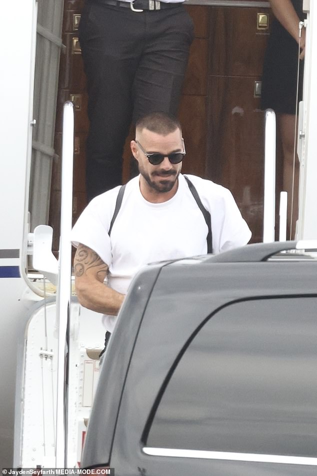 He went casual for the flight, stepping out in a crisp white T-shirt that was loose-fitting on his chiselled frame