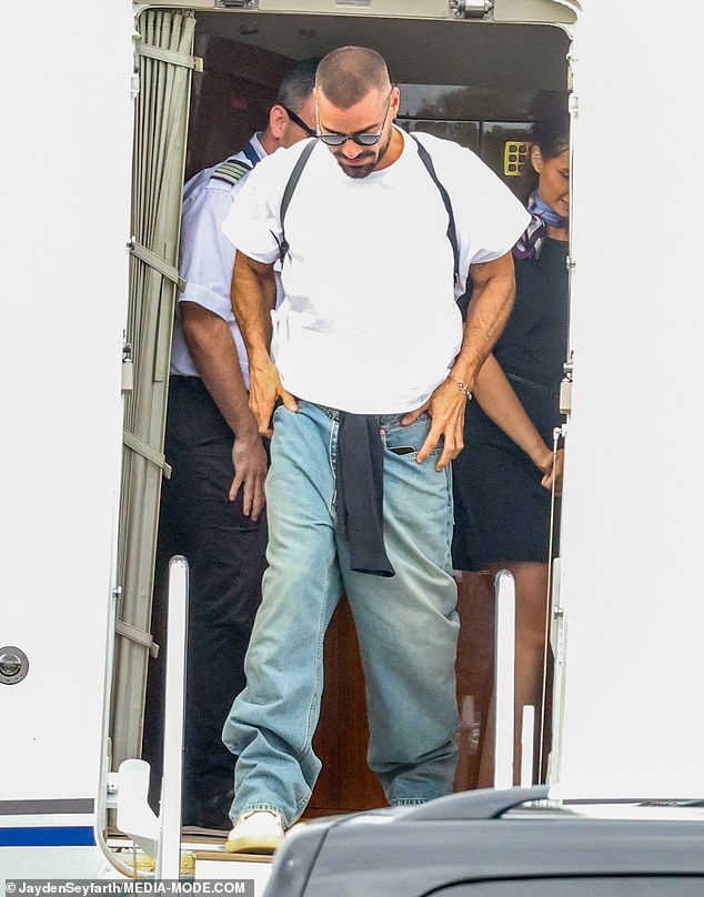 Sporting a stoic expression as he walked to a waiting car, Ricky looked all business, his mind focused on Saturday night's performance