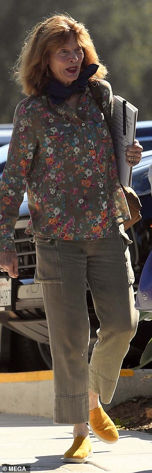 She wore a pretty floral print top, khaki slacks, and mustard yellow sneakers