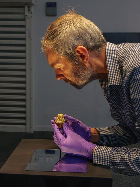 NMS curator Craig Angus with the jar. Pic: NMS/Andy Jardine