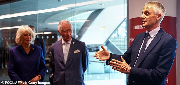 (FILES) Britain's Prince Charles, Prince of Wales and Britain's Camilla, Duchess of Cornwall listen to BBC Director-General Tim Davie during their visit to the BBC World Service, in London, on April 28, 2022, for its 90th anniversary. Tim Davie has announced on November 11, 2025 he will step down as director-general of the BBC. It comes after concerns have been raised about impartiality at the corporation, including how a speech by US President Donald Trump was edited in an episode of Panorama. (Photo by HANNAH MCKAY / POOL / AFP) (Photo by HANNAH MCKAY/POOL/AFP via Getty Images)