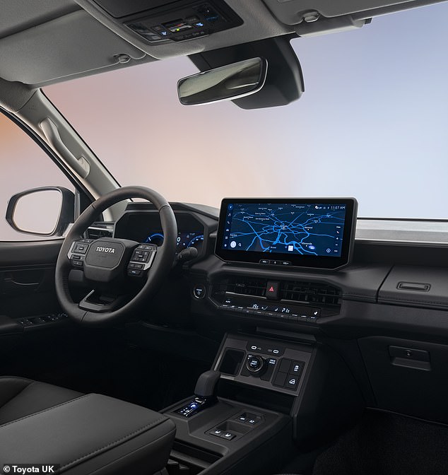 The simple cabin layout is dominated by a new portrait centre console unit housing the adaptable driving surface settings