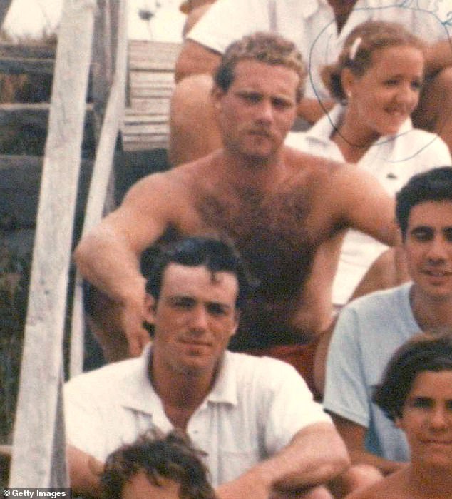 Tommy Skakel is pictured shirtless, his brother Michael is in a white shirt beneath him