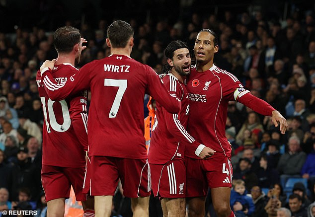 Van Dijk celebrates with his team-mates after scoring - although that joy was short-lived