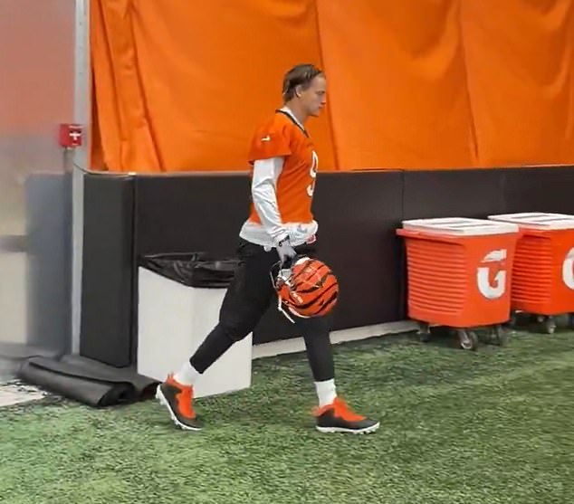 Burrow is pictured returning to practice on Monday afternoon with the Cincinnati Bengals