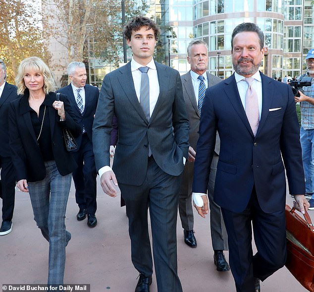 Wearing a gray suit with a white shirt and tie, Bohm showed little emotion, his expression turning to confusion as Judge Rubenstein denied his bid to have the murder charges thrown out