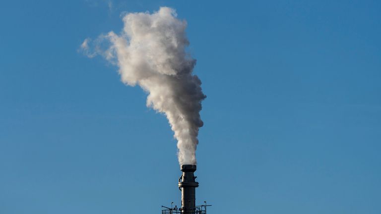 Steam comes from a tower in oil refinery near Salt Lake City, Utah. Pic: AP