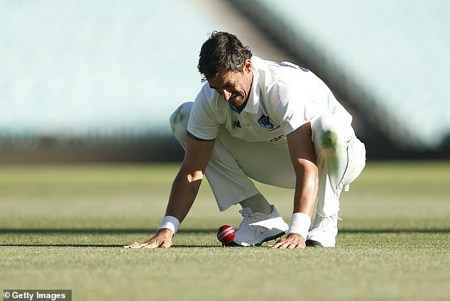 Starc is pictured taking part in the ongoing Sheffield Shield match for NSW against Victoria on Monday in preparation for the series against England