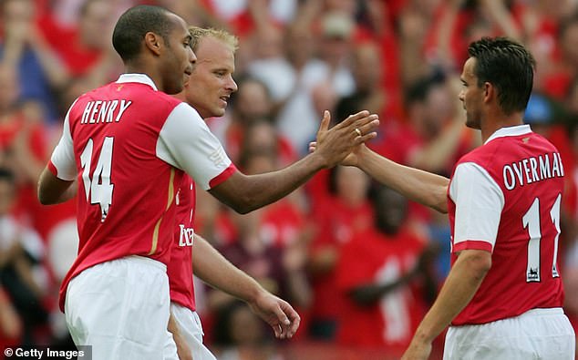 Overmars, pictured with fellow Arsenal legends Dennis Bergkamp (left) and Thierry Henry (centre) in 2006, was part of one of the great Gunners sides