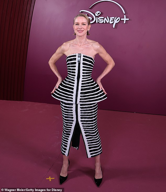 Watts bared her arms in a strapless black-striped peplum dress and black pumps selected by stylist Jeanann Williams