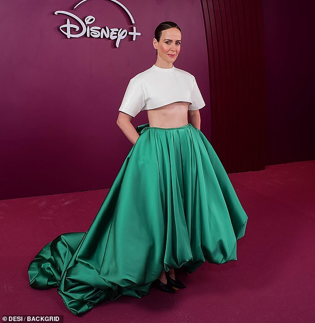Paulson flashed her taut tummy in a white cropped T-shirt and a voluminous green maxi-skirt selected by stylist Karla Welch