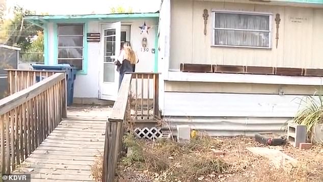 The home Terri lived in with her husband, Delbert 'Dale' Ackerman (Pictured: A KDVR reporter knocks on the door)