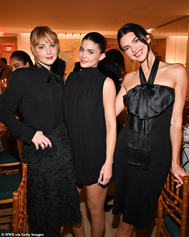 All three favored all-black looks. Jennifer wore a black blouse with a textured skirt, while Kylie favored a sleeveless sack dress and Kendall wore a slinky off-the-shoulder bodycon dress with a satin scarf tied around her throat