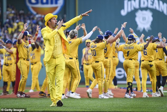 Jesse Cole, who dresses in a yellow tuxedo, is the team owner and creator of Banana Ball
