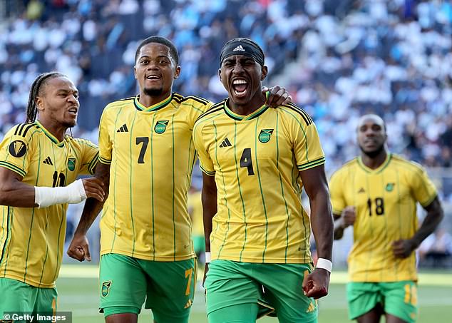 Amari'i Bell (No 4), Leon Bailey (7) and Bobby De Cordova-Reid (10) celebrate a Jamaica goal