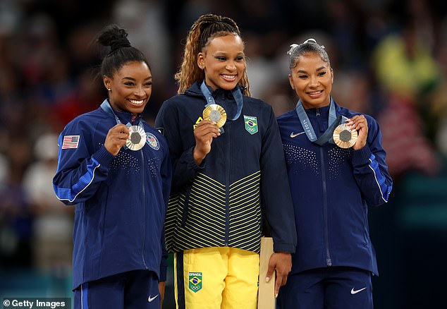 Chiles, pictured alongside Brazil's Rebeca Andrade (center) and Simone Biles (left), said people 'didn't want to see three beautiful Black women standing on that podium'