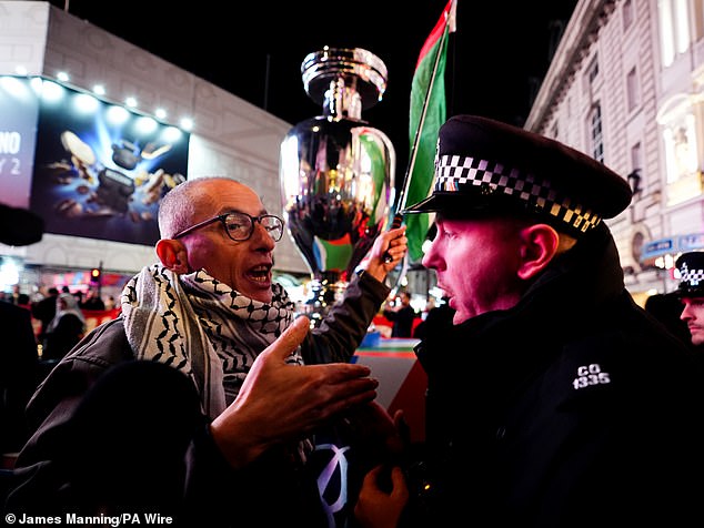 A noisy group with ‘Free Palestine’ flags protested outside at the venue in Piccadilly Circus