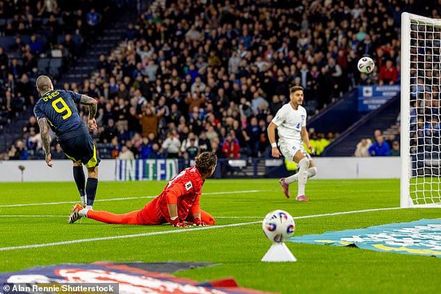 Dykes scores the late goal against Greece that completed a remarkable comeback last month