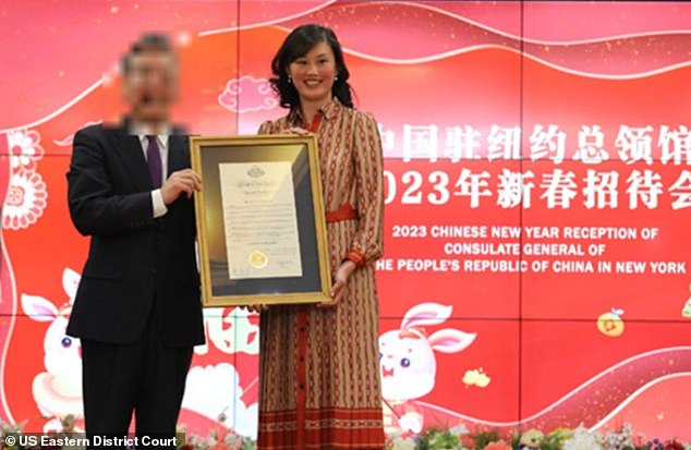 Sun is seen above being honored at a People's Republic of China consulate event in an image included in the Department of Justice's indictment