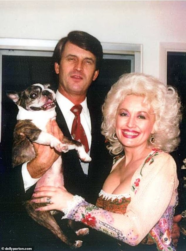 She said in 2023: 'I haven't missed it like I thought I might. When you're a young couple, you think you're going to have kids, but it just wasn't one of those burning things for me' (pictured with her husband Carl Dean)