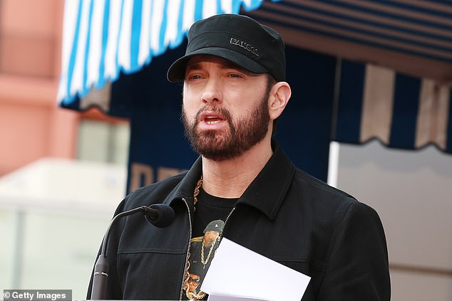 The couple have named their Australian beachwear brand 'Swim Shady', however American rapper Eminem (pictured) who goes by the name Slim Shady, has issued an objection to their trademark