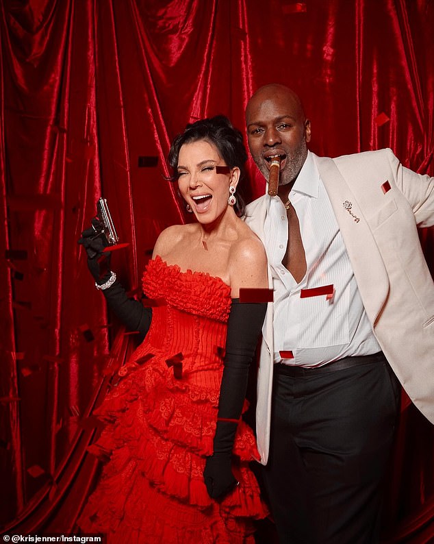 Kris , 70, looked the ultimate Bond girl as she brandishes a pistol at her 007-themed birthday party alongside her partner Corey Gamble, 45