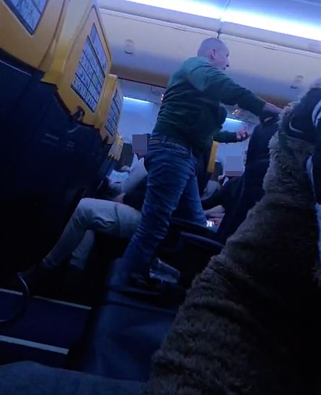 Near landing, the man refused repeated orders to sit, forcing the pilot to abandon the approach