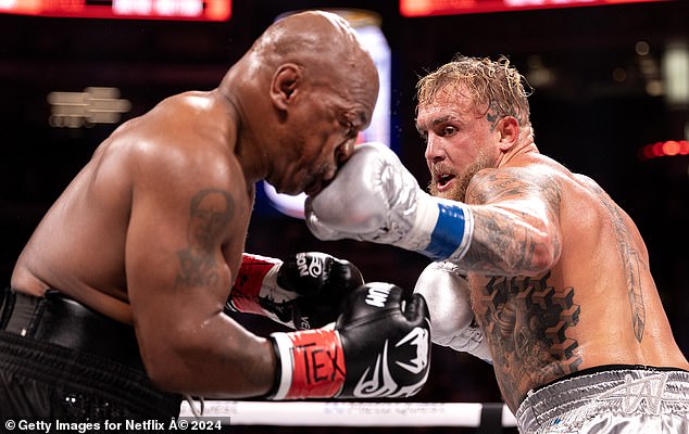 And Jake Paul (pictured here fighting Mike Tyson last November) can provide that addictive adrenaline rush by the bucket-full
