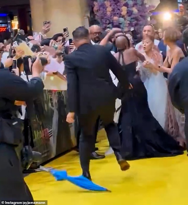 The actress, 32, was walking beside her co-star Cynthia Erivo, 38, who bravely jumped in front of Ariana when she saw the man running towards them