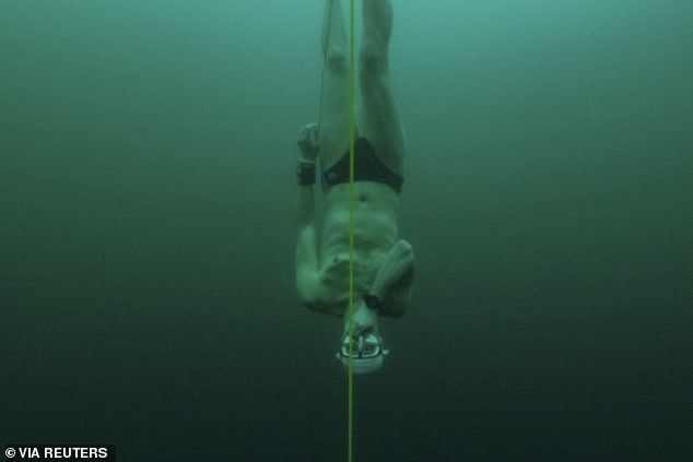 The dive has broken the previous record, set by David Vencl (pictured) in 2023, when he reached 52m (171ft) under the ice