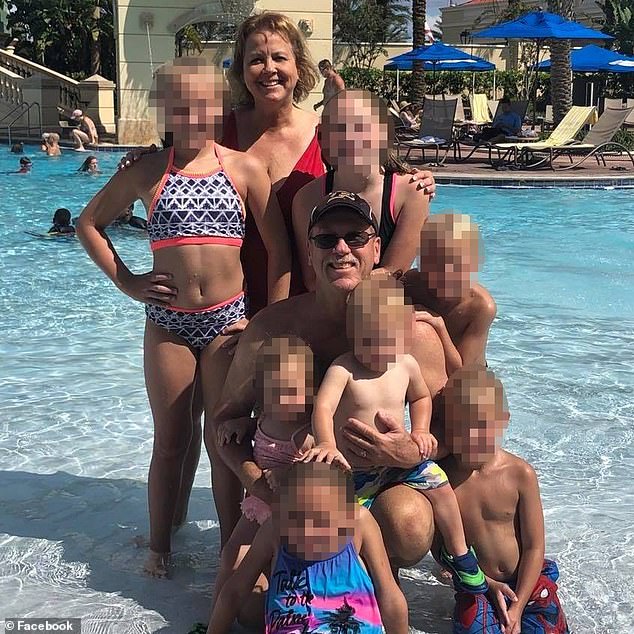 Bob and MaryBeth pictured with seven young members of their family. MaryBeth gave birth to a girl in 2020 when she was 62 and is then accused of secretly arranging for a further pregnancy with a surrogate three years later