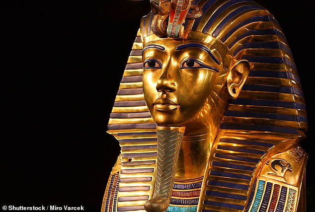 King Tut was decapitated after archaeologist Howard Carter's team removed his famous golden mask (Pictured) which was buried with the ruler 3,300 years ago