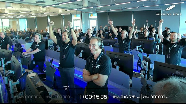 Blue Origin staff cheering wildly at their successful touchdown