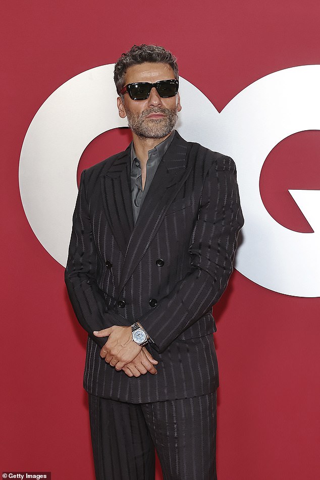 Oscar Isaac, 46, was dapper in a black suit and sunglasses